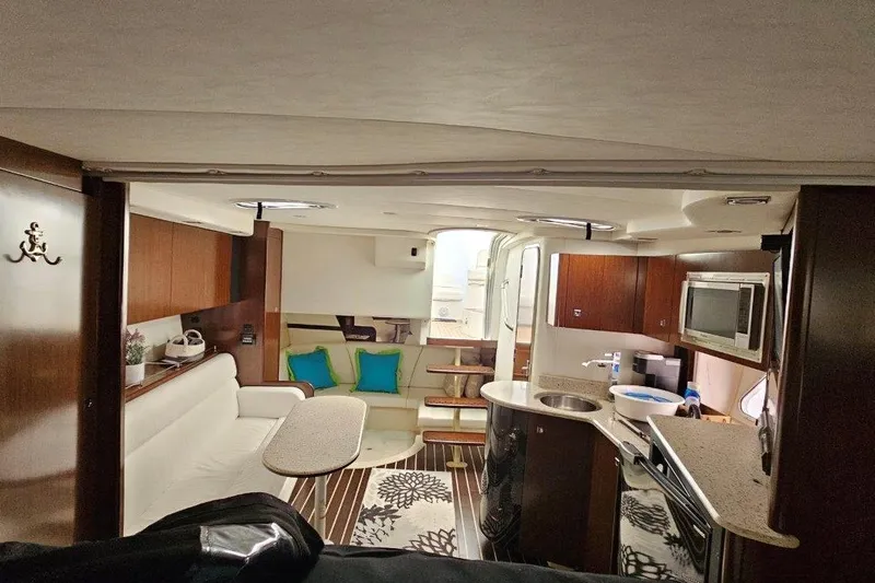  Yacht Photos Pics 2012 Cruisers Yachts 380 Express interior with modern kitchen and cozy seating area.