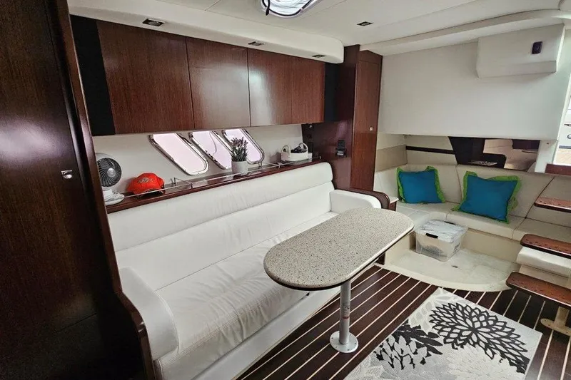  Yacht Photos Pics Interior of 2012 Cruisers Yachts 380 Express with modern seating and wooden cabinetry.