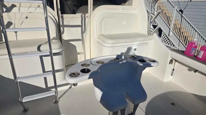 Rack Em Up Yacht Photos Pics 2008 Ocean Yachts 37 Billfish cockpit with ladder and seating area.