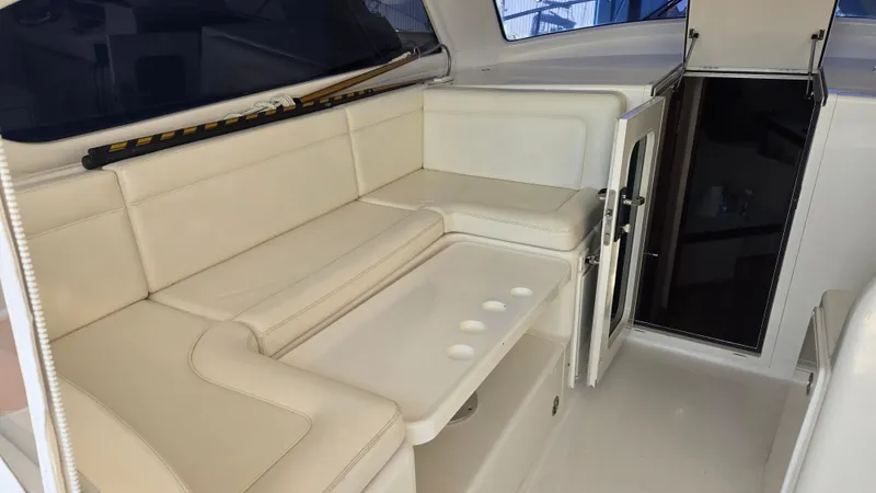 Rack Em Up Yacht Photos Pics Interior of 2008 Ocean Yachts 37 Billfish with beige seating and storage.