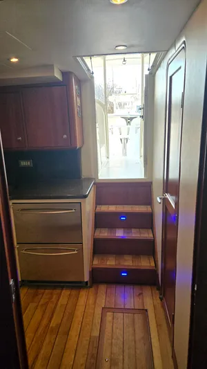 Rack Em Up Yacht Photos Pics Interior of 2008 Ocean Yachts 37 Billfish with wooden flooring and modern cabinetry.