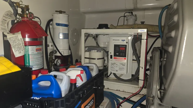 Rack Em Up Yacht Photos Pics Engine room of 2008 Ocean Yachts 37 Billfish with equipment and supplies.