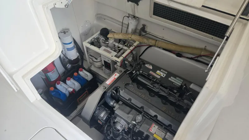 Rack Em Up Yacht Photos Pics Engine compartment of 2008 Ocean Yachts 37 Billfish with maintenance supplies.