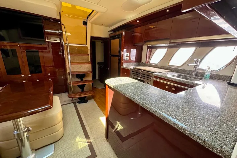  Yacht Photos Pics Luxurious interior of 2008 Sea Ray 48 Sundancer yacht with modern kitchen and seating area.