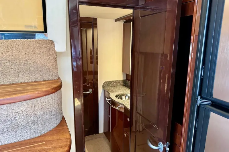  Yacht Photos Pics Interior of 2008 Sea Ray 48 Sundancer yacht with wooden stairs and compact bathroom.