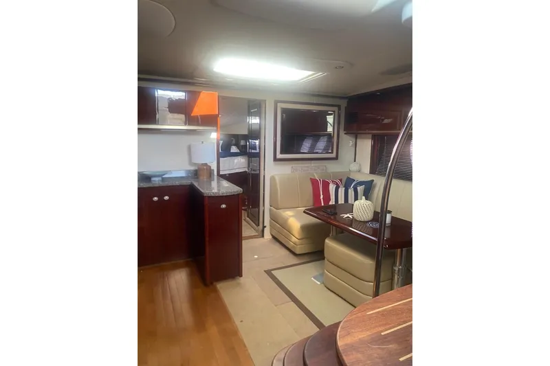 Yacht Photos Pics Luxurious interior of 2008 Sea Ray 48 Sundancer yacht with elegant seating and modern decor.