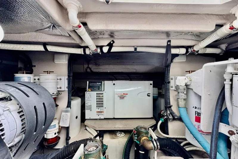  Yacht Photos Pics Engine room of 2008 Sea Ray 48 Sundancer with Cummins Onan generator and various mechanical components.