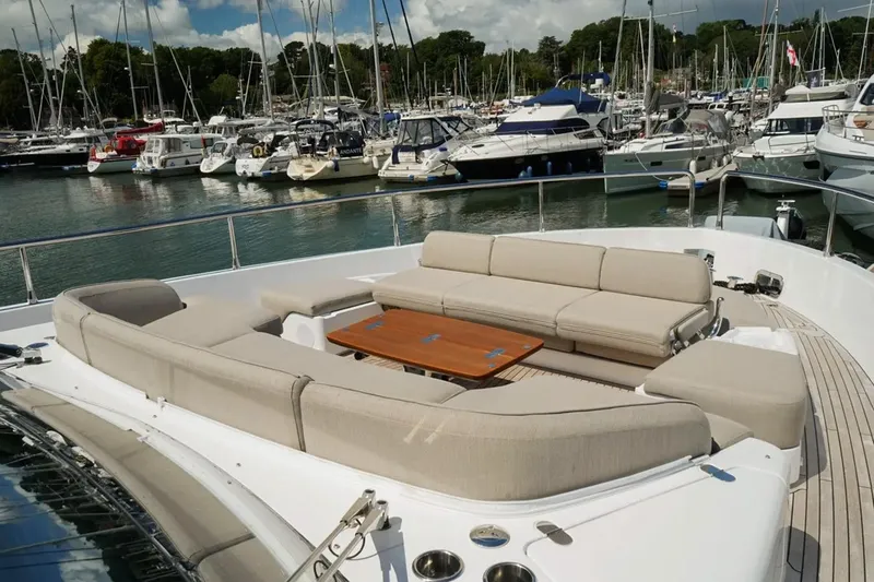  Yacht Photos Pics Luxurious seating area on 2024 Azimut Magellano 60 yacht in marina.