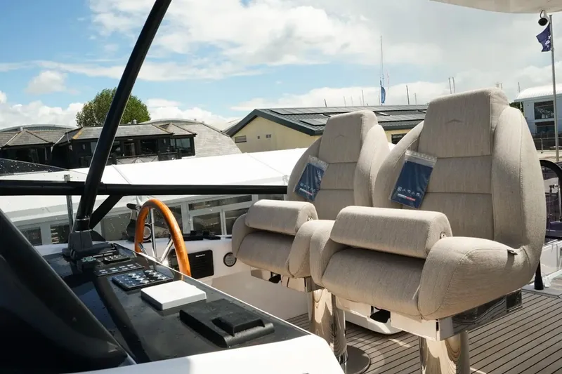  Yacht Photos Pics Luxurious helm seats on the 2024 Azimut Magellano 60 yacht, featuring modern design and comfort.