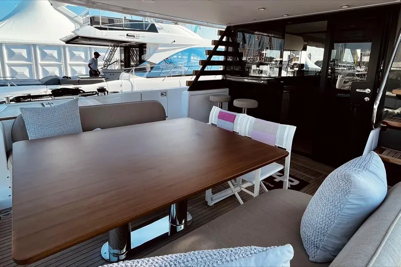  Yacht Photos Pics Luxurious 2024 Azimut Magellano 60 yacht interior with elegant dining area and modern design.