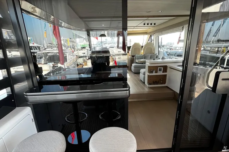  Yacht Photos Pics 2024 Azimut Magellano 60 yacht interior with modern seating and sleek design.