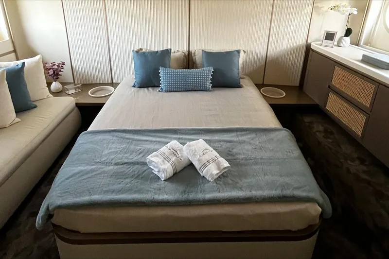  Yacht Photos Pics Luxurious bedroom interior of 2024 Azimut Magellano 60 yacht with elegant bedding and decor.