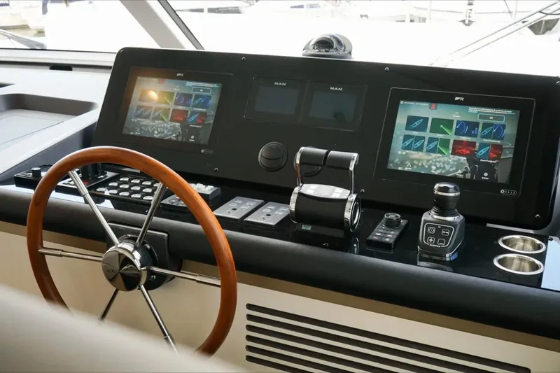  Yacht Photos Pics Control panel of 2024 Azimut Magellano 60 yacht with modern navigation screens.