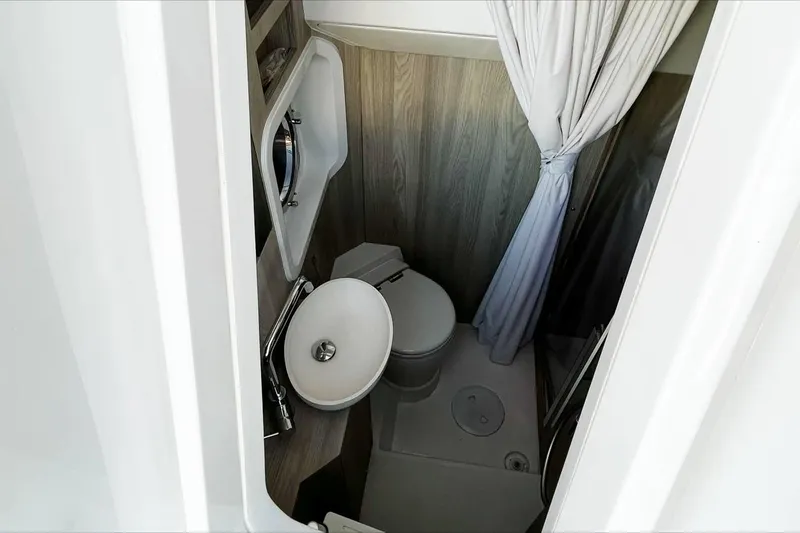  Yacht Photos Pics 2024 Azimut Magellano 60 yacht bathroom with modern fixtures and compact design.