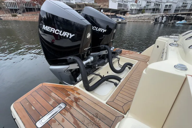  Yacht Photos Pics 2026 Chris-Craft Calypso 28 with dual Mercury Verado outboard engines on a wooden deck.