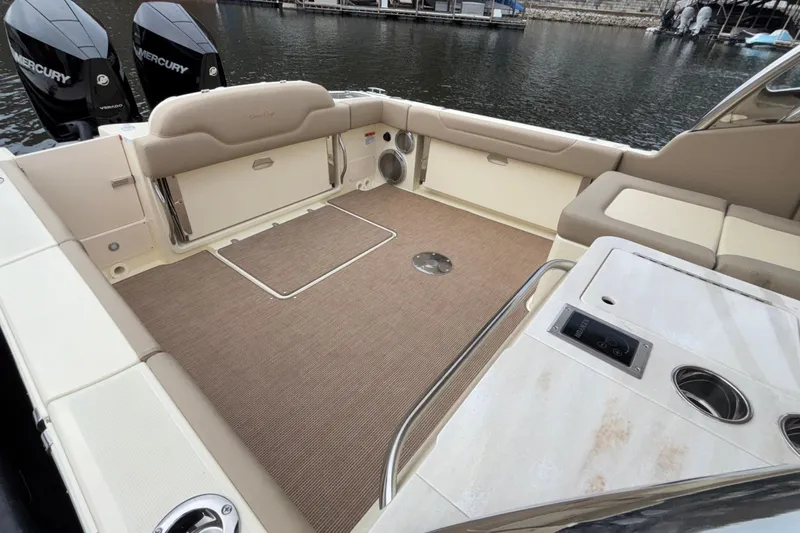  Yacht Photos Pics 2026 Chris-Craft Calypso 28 boat interior with seating and Mercury engines.