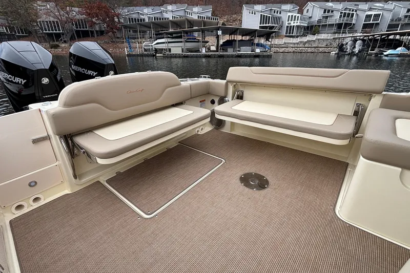  Yacht Photos Pics 2026 Chris-Craft Calypso 28 boat interior with seating and Mercury engines.