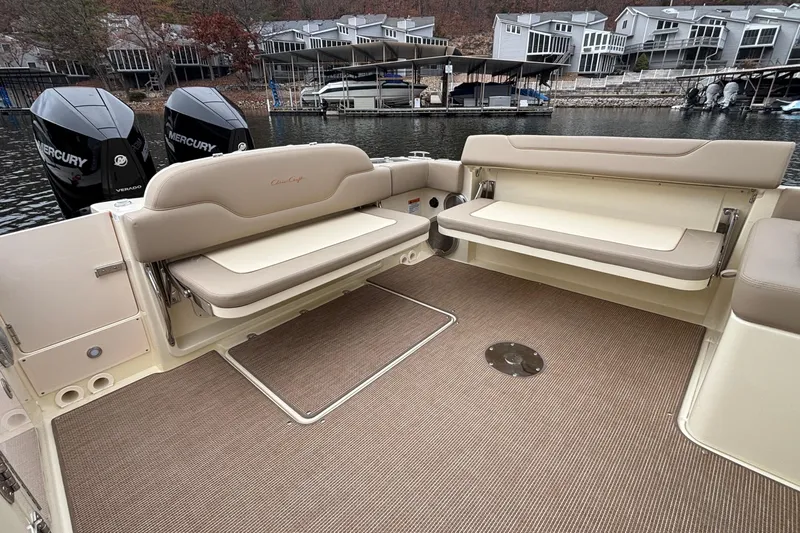  Yacht Photos Pics 2026 Chris-Craft Calypso 28 boat interior with beige seating and twin Mercury engines.