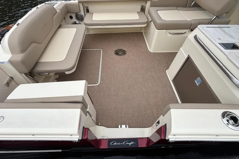  Yacht Photos Pics Luxurious interior of 2026 Chris-Craft Calypso 28 boat with beige seating and carpet.