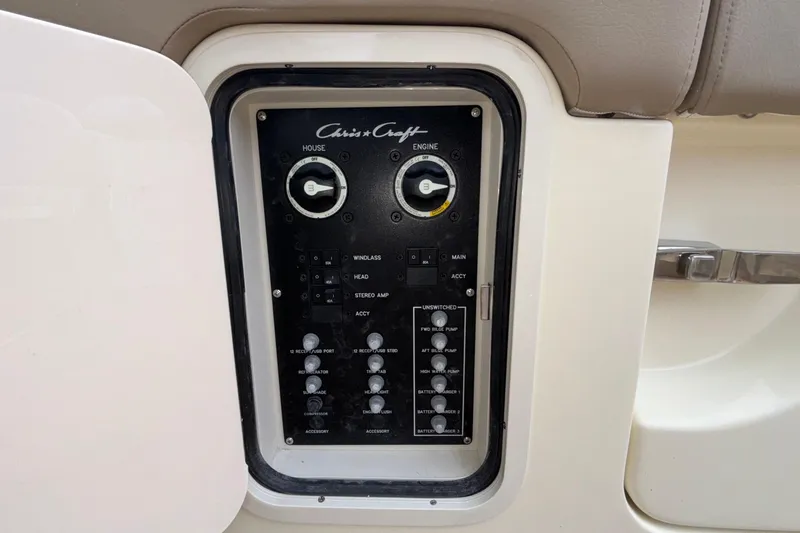  Yacht Photos Pics Control panel of 2026 Chris-Craft Calypso 28 boat, featuring various switches and dials.
