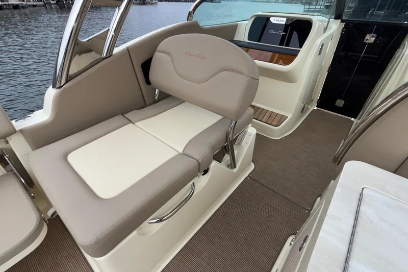 Yacht Photos Pics 2026 Chris-Craft Calypso 28 boat interior with beige seating and elegant design.
