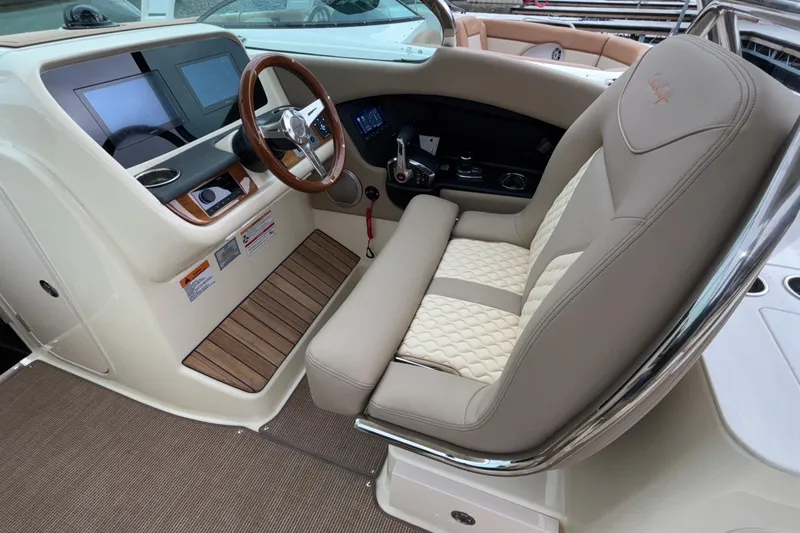  Yacht Photos Pics 2026 Chris-Craft Calypso 28 helm with luxurious seating and modern dashboard controls.