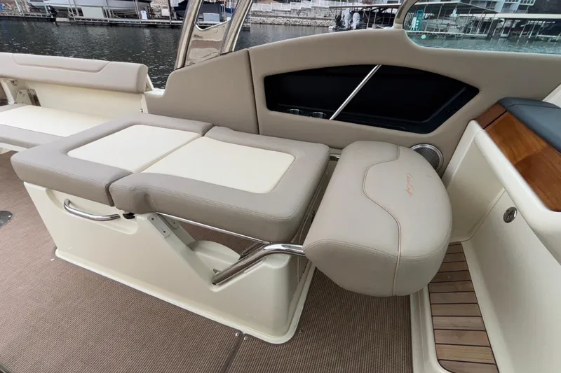  Yacht Photos Pics 2026 Chris-Craft Calypso 28 interior seating with beige upholstery and elegant design.