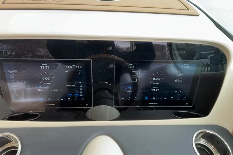  Yacht Photos Pics Dashboard of 2026 Chris-Craft Calypso 28 with dual Garmin displays showing navigation data.