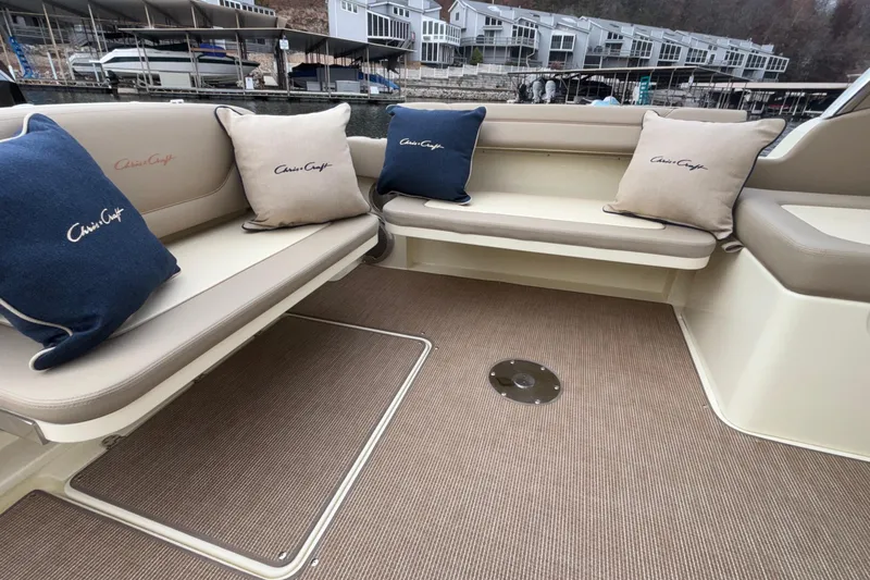  Yacht Photos Pics Interior seating of 2026 Chris-Craft Calypso 28 with branded cushions, dockside view.