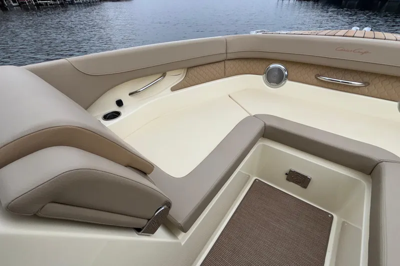  Yacht Photos Pics 2026 Chris-Craft Calypso 28 boat interior with beige seating and elegant design.