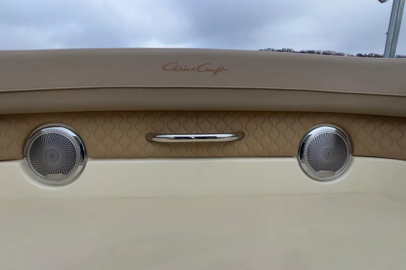  Yacht Photos Pics 2026 Chris-Craft Calypso 28 boat interior with speakers and elegant beige upholstery.