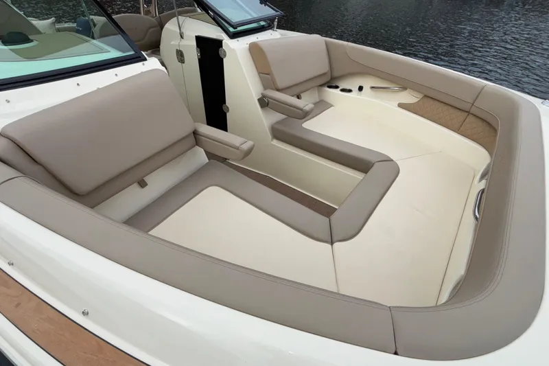  Yacht Photos Pics Luxurious seating area on 2026 Chris-Craft Calypso 28 boat, featuring elegant beige upholstery.