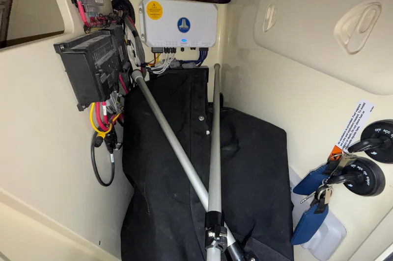  Yacht Photos Pics Interior view of 2026 Chris-Craft Calypso 28 boat showing electrical components and storage.