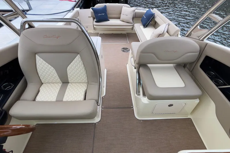  Yacht Photos Pics Luxurious interior of 2026 Chris-Craft Calypso 28 boat with elegant seating and cushions.