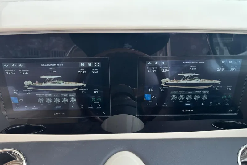  Yacht Photos Pics 2026 Chris-Craft Calypso 28 dashboard with dual Garmin displays showing boat controls.