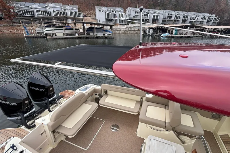  Yacht Photos Pics 2026 Chris-Craft Calypso 28 boat with Mercury engines docked near waterfront homes.