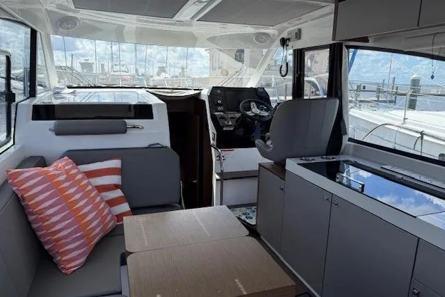 Venture Yacht Photos Pics Interior of 2024 Beneteau Antares 11, featuring modern seating and navigation area.