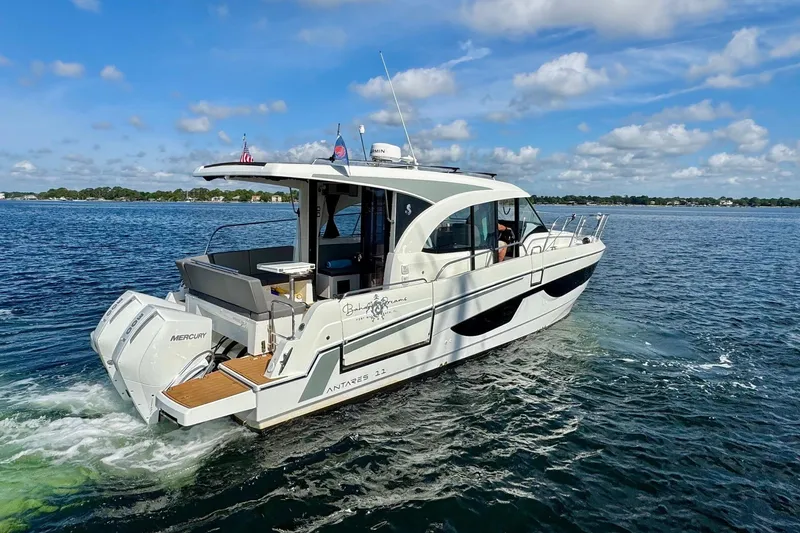 Venture Yacht Photos Pics 2024 Beneteau Antares 11 cruising on a sunny day with clear skies.