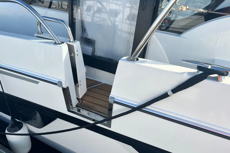 Venture Yacht Photos Pics 2024 Beneteau Antares 11 boat deck with railing and mooring line.