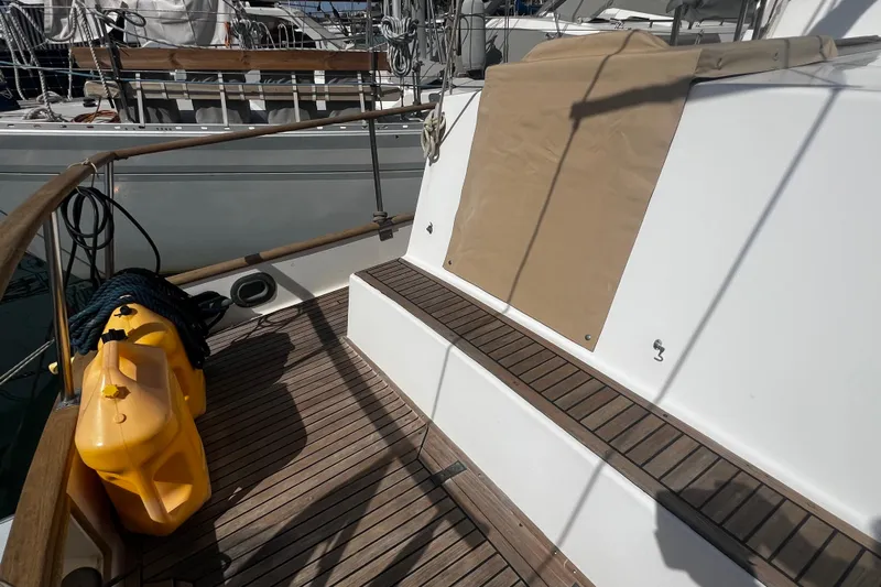 Apta Yacht Photos Pics 1989 Grand Banks 36 Classic deck with wooden flooring and yellow fuel container.
