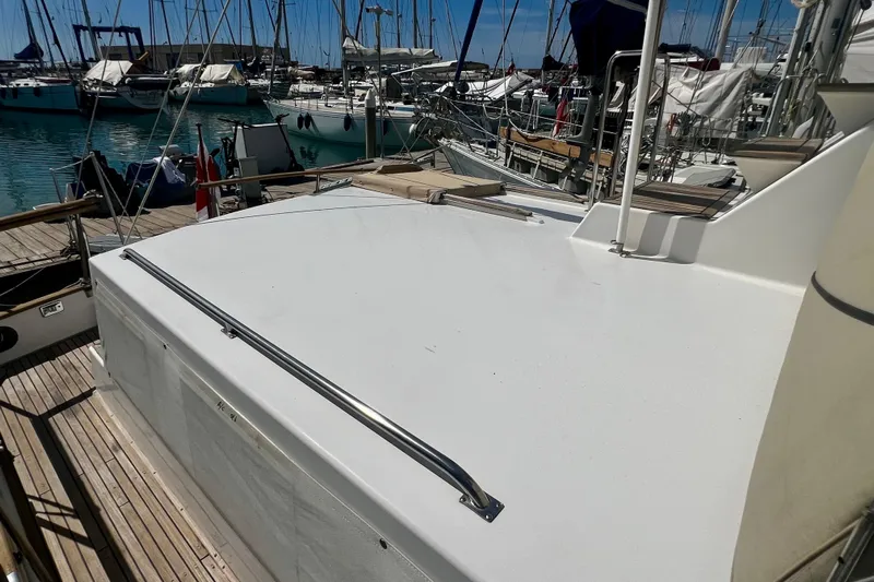 Apta Yacht Photos Pics 1989 Grand Banks 36 Classic yacht docked at marina, surrounded by sailboats.
