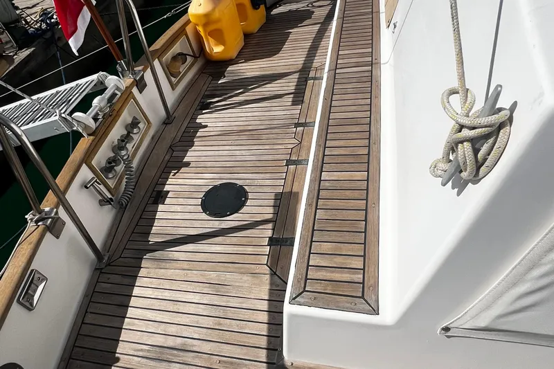 Apta Yacht Photos Pics 1989 Grand Banks 36 Classic yacht deck with wooden flooring and nautical equipment.