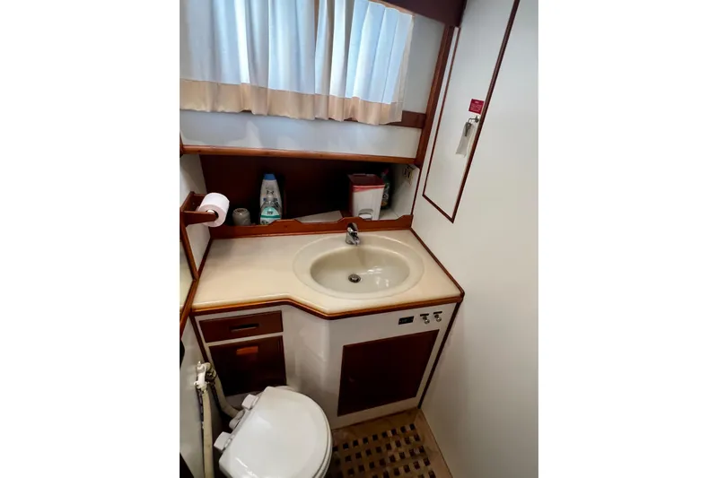 Apta Yacht Photos Pics Bathroom interior of 1989 Grand Banks 36 Classic yacht, featuring sink and toilet.