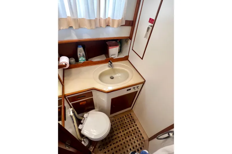 Apta Yacht Photos Pics Bathroom interior of 1989 Grand Banks 36 Classic yacht with sink and toilet.