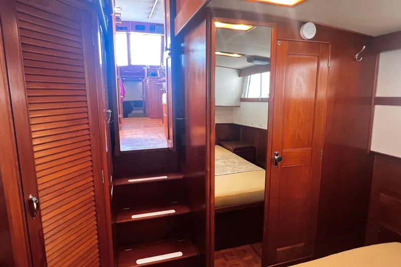 Apta Yacht Photos Pics Interior of 1989 Grand Banks 36 Classic yacht with wooden finishes and cozy cabin.