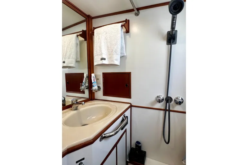 Apta Yacht Photos Pics Bathroom interior of 1989 Grand Banks 36 Classic yacht with sink and shower.