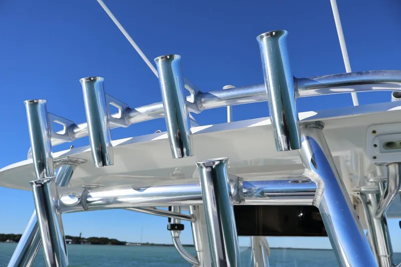  Yacht Photos Pics 2007 Contender 33 Tournament boat with stainless steel rod holders against blue sky.