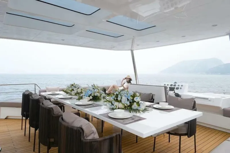  Yacht Photos Pics Luxurious 2025 GZ Yachts TY560 with elegant dining setup and ocean view.