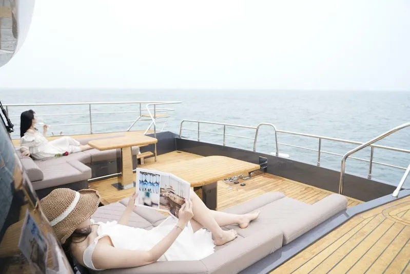  Yacht Photos Pics Women relaxing on the deck of a 2025 GZ Yachts TY560, enjoying the ocean view.