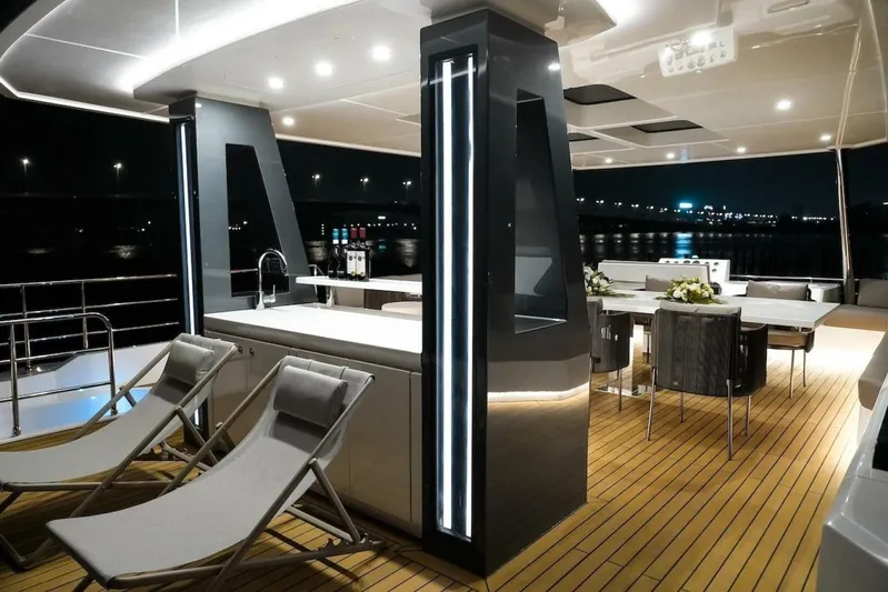  Yacht Photos Pics Luxurious 2025 GZ Yachts TY560 deck with modern seating and ambient lighting at night.